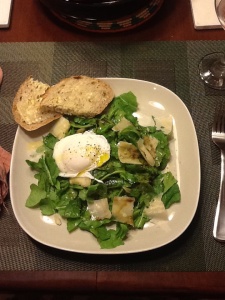 Arugula salad with poached egg, shaved reggiano, and balsamic dressing.